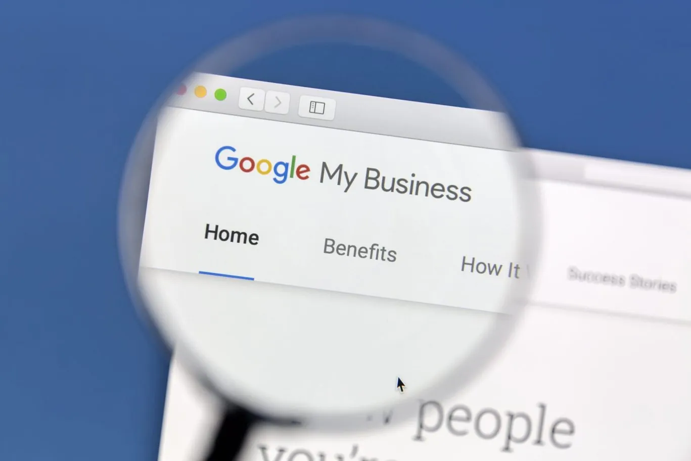 Magnifying glass focusing on computer screen on Google My Business view